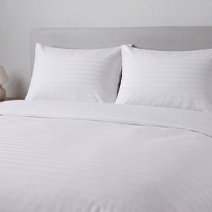 White striped bedding set including a duvet cover and two pillows