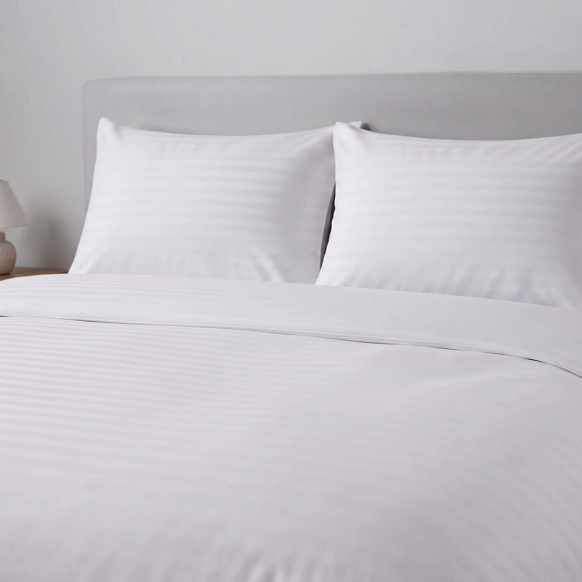 White striped bedding set including a duvet cover and two pillows